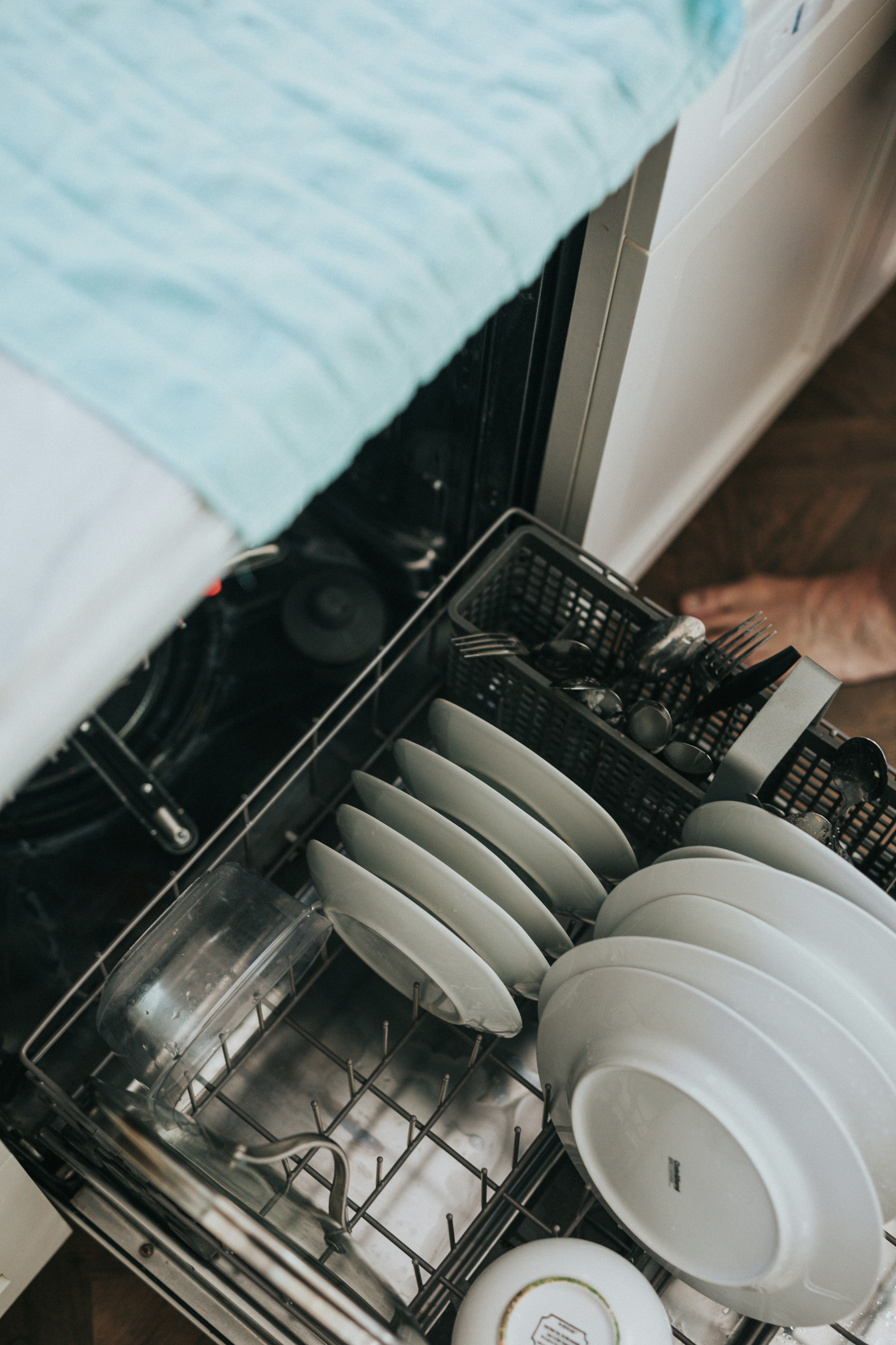 white dishes in the dishwasher