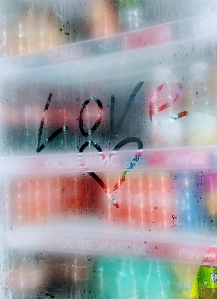 a foggy freezer with "love" and a heart scribbled onto the door